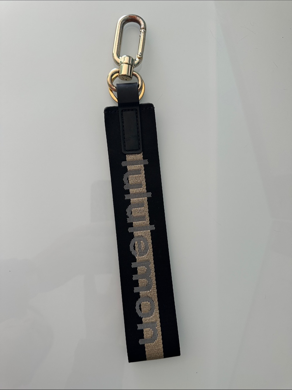 Lululemon Black and Gold Logo Strap Keychain Wrist Holder